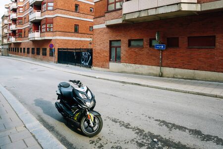 STOCKHOLM, SWEDEN - JULY 30, 2014: Yamaha scooter parked at sidewalk on the Brunnsgatan street Stockholmのeditorial素材