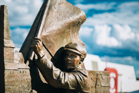 OSLO, NORWAY - JULY 31, 2014: Statue near Lighthouse at Aker Brygge In Oslo Embankment, Norway.のeditorial素材