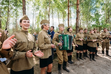 SVETLAHORSK, BELARUS - JUNE 21, 2014: Unidentified artists dressed as Soviet Russian soldiers dance during events dedicated to 70th anniversary of Soviet Belorussian offensive operation Bagration.のeditorial素材