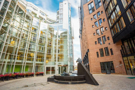 OSLO, NORWAY - JULY 31, 2014: Typical Example Of Scandinavian Architecture. Exterior Building in Aker Brygge is a popular area for for shopping, dining, and entertainment in Oslo, Norwayのeditorial素材