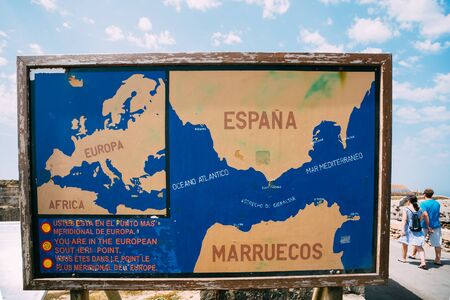Old painted Information board on the beach Costa de la Luz in Tarifa, Spain. Tarifa is the most southern town of Europe on the Strait of Gibraltarの写真素材