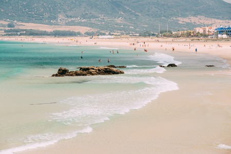 People resting at beach in Tarifa, Spain. Tarifa is most popular places in Spain for vacationの写真素材