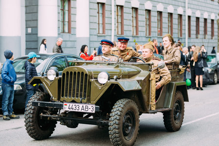 Gomel, Belarus - May 9, 2015: People uniformed Soviet soldiers and officers involved in the parade dedicated to the Victory Day on vehicles of World War II.のeditorial素材