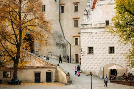 Cesky Krumlov, Czech Republic - October 12, 2014: People walking near castle tower in Cesky Krumlov, Czech republic. UNESCO World Heritage Siteのeditorial素材