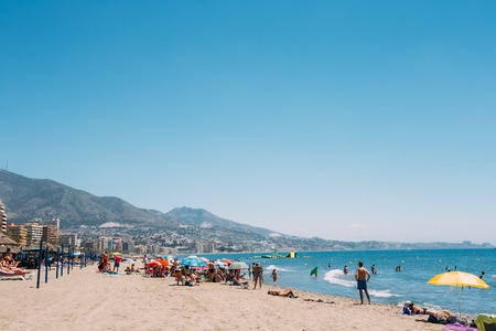 Fuengirola, Spain - June 23, 2015: People resting at beach in  Costa del Sol in Fuengirola, Spain. Fuengirola is popular places in Spain for vacationのeditorial素材
