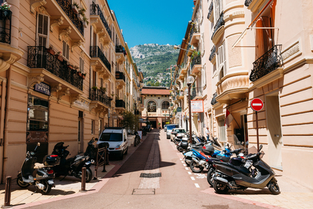 Monte-Carlo, Monaco - June 28, 2015: Motorbikes, motorcycles scooters parked in row in city streetのeditorial素材