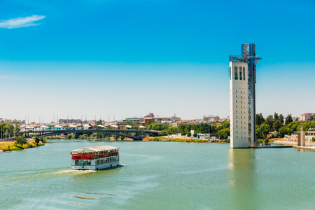 Seville, Spain - June 24, 2015: Cruise ship floating in Guadalquivir riverのeditorial素材