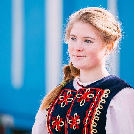 Gomel, Belarus - March 12, 2016: Portrait of unknown beautiful young woman girl in national folk clothes at Celebration of Maslenitsa Shrovetide holiday.のeditorial素材