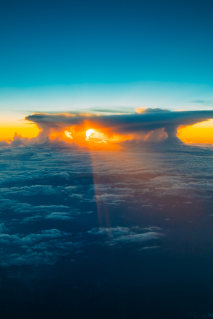 Amazing Sunset Sunrise Over Mountains From Height Of Airplane, Plane. Bright Blue, Orange, Yellow And Blue Colors Of Sunrise Sky Background. Warm And Cold Colors.の写真素材