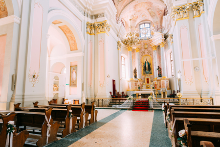 Minsk, Belarus - May 20, 2015: Interior of Cathedral of Saint Virgin Mary in Minsk, Belarus. Church pews and altarのeditorial素材