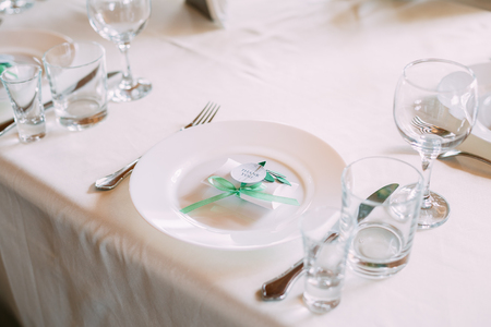 Wedding Candy-box Lies On A Plate. Bomboniere Also Known As Favors, Are Gifts Given By Hosts To Their Guests On Special Occasions Such As Bar And Bat Mitzvahs, Weddings Etc. Decoration For Wedding Celebration.の写真素材