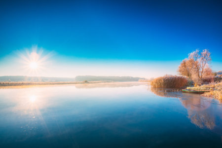 Sunset Sunrise Sun Rises Over River. Autumn Morningの写真素材