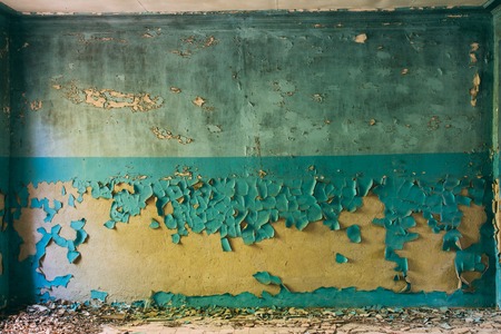 Wall With Cracked And Peeling Surface Of Blue And Brown Or Yellow Paint.の写真素材