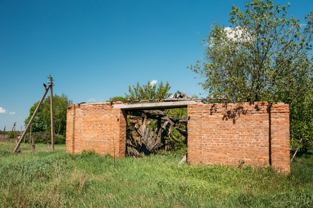 The Ruined Brick Building In The Exclusion Rural Area After Chernobyl Catastrophe. The Consequences Of The Nuclear Pollutionの写真素材