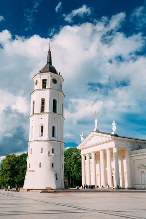 Vilnius, Lithuania. Cathedral Basilica Of St. Stanislaus And St. Vladislav With The Bell Tower In Summer Sunny Day,  Blue Cloudy Sky Background. Roman Catholic Cathedral At The Cathedral Square.の写真素材