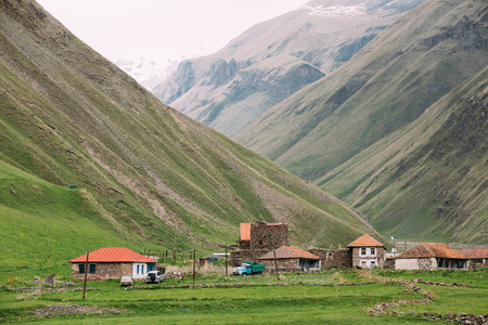 Village With Dilapidated Houses In Truso Gorge, Kazbegi District, Mtskheta-Mtianeti Region, Georgia. Spring Or Summer Seasonの写真素材