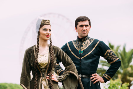Batumi, Adjara, Georgia - May 26, 2016: Young couple of man and woman in Georgian national clothes...