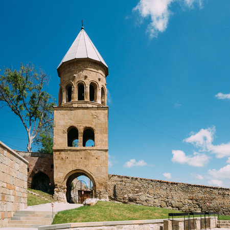 Mtskheta, Georgia. The Three-Storey Bell Tower At Samtavro Monastery Complex Area With Stone Wall In...