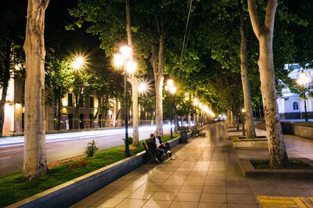 Tbilisi Georgia. Two Men On Bench On Platanus Alley Of Rustaveliのeditorial素材