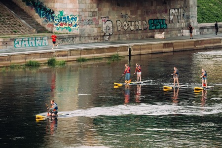 Vilnius, Lithuania. Young People Stand Up Paddling SUP Or Standupのeditorial素材