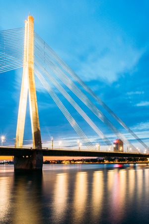 Riga Latvia. Scenic View Of Vansu Cable-Stayed Bridge In Night Illumination Over The Daugava River,の写真素材