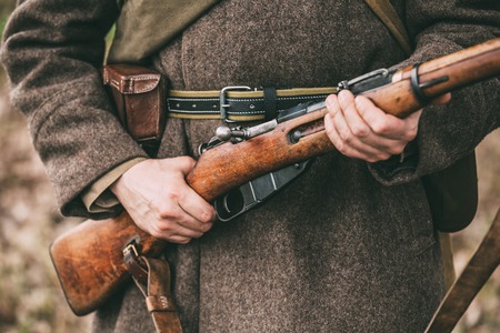 Russian Soviet Infantry Soldier Of World War II Holds Rifle Weapの写真素材