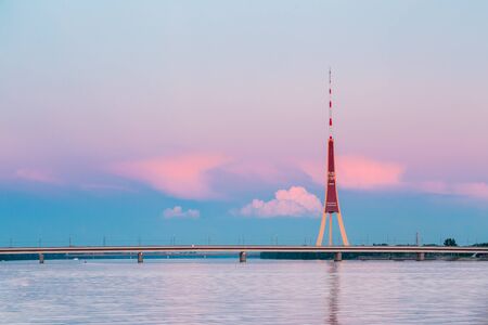 Riga, Latvia. Famous Landmark Television Tower In Pink Purple Sunset Or Sunrise Colors Sky.の写真素材