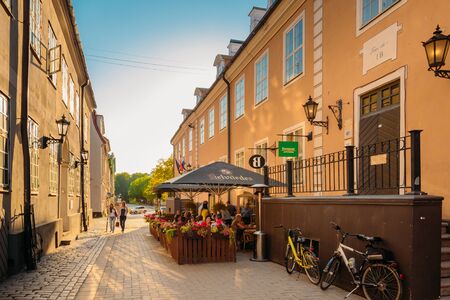 Riga, Latvia. People Resting In Cafe Restaurant And Walking On Torna Streetのeditorial素材