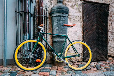 Bicycle Bike Parked Near Old Cannon On Street In Old Part European Townの写真素材