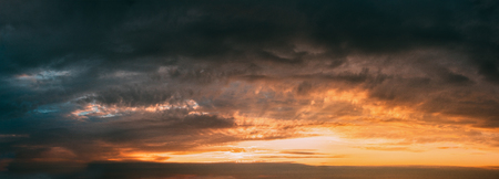 Bright And Dark Blue and Yellow Dramatic Sky Before Thunder. Cloの写真素材