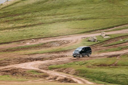 Truso Gorge, Georgia - May 22, 2016: Mitsubishi Delica Space Gear on country road in summer mountains landscape. Delica is a range of trucks and multi-purpose vehicles produced by Mitsubishi Motors.のeditorial素材