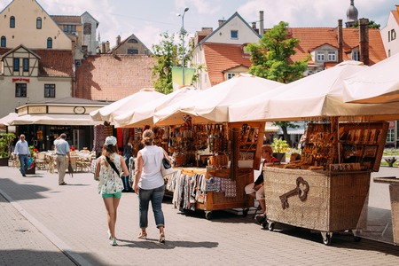 Tourists People Walking In Street Near Market In Livu Square.のeditorial素材