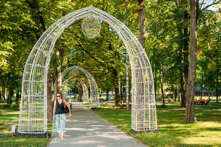 Gomel, Belarus. Young Woman Passing Through Decorative Archesのeditorial素材