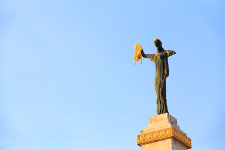 Batumi, Adjara, Georgia. Statue Of Medea On Blue Sky Background In Europe Square. Woman Holding Golden Fleece. In Greek Mythology, Medea Was Daughter Of King Aeetes Of Colchis And Wife To Hero Jasonの写真素材