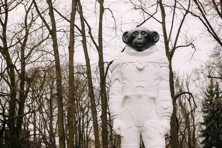 Riga, Latvia - December 13, 2016: Monkey statue in a spacesuit in Kronvalda park. Statue is dedicated to animals that participated in exploration of outer space. Author is artist Denis Prasolov.のeditorial素材