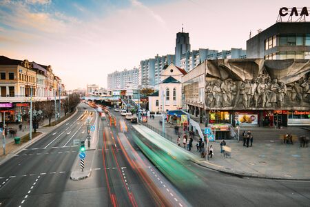 Minsk, Belarus - April 3, 2017: Cathedral of Saints Peter and Paul - temple of Belarusian Exarchate of Russian Orthodox Church and Bas-relief of the Soviet era on old facade building on Nemiga Streetのeditorial素材