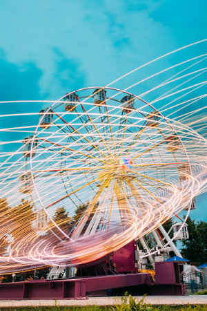 Motion Blurred Of High Speed Rotating Attraction Amusement Park.