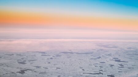Aerial View From High Altitude Flight Of Aircraft On Snow-covereの写真素材