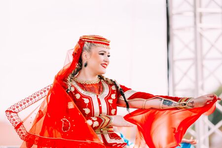 Young woman dressed in traditional folk costume dancing Azerbaijのeditorial素材