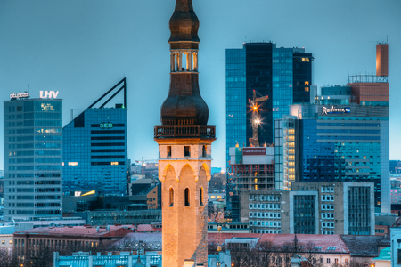Tallinn, Estonia. Tower Of Town Hall On Background With Modern Uのeditorial素材