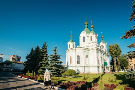 Brest, Belarus. Elderly Woman Walking Near Simeons Stylites Cathedral Churchの写真素材