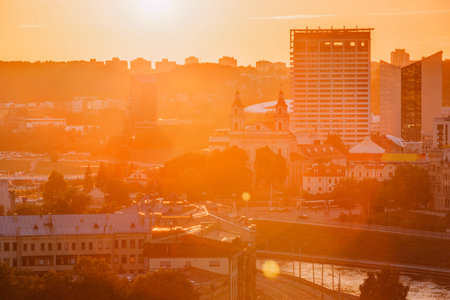 Vilnius, Lithuania. Sunset Sunrise Dawn Over Cityscape. Church Of St Raphael The Archangel And Former Jesuit Monastery. Business District New City Centre Shnipishkesの写真素材