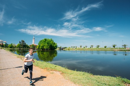 Batumi, Adjara, Georgia. Man athlete jogging on a summer sunny dayのeditorial素材