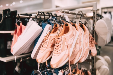 Close View Of Fashion Casual Female Sneakers On Hunger In Storeの写真素材