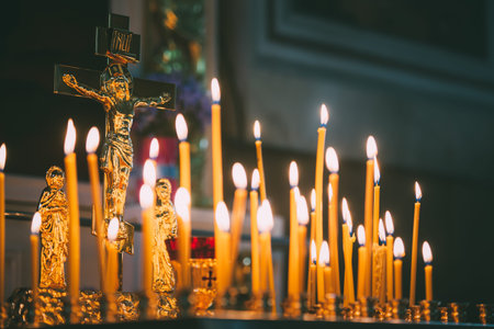 Church candles at dark background