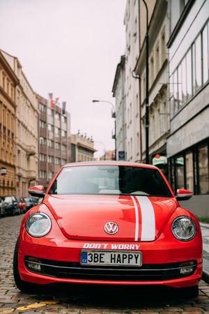 Front View Of Red Volkswagen New Beetle Cabriolet Car Parked In Streetのeditorial素材