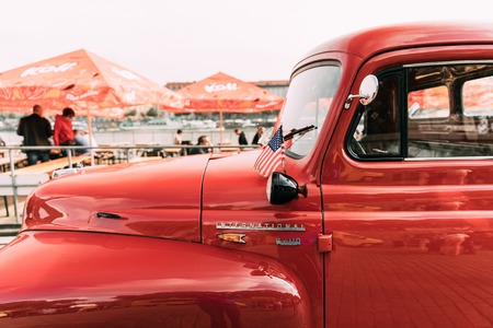 Prague, Czech Republic - September 23, 2017: Close Side View Of Red International Harvester R-series Truck With Small American Flag Parked In Street.のeditorial素材