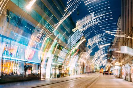 Helsinki, Finland. Abstract Background Of Night View Of Aleksanterinkatu Street