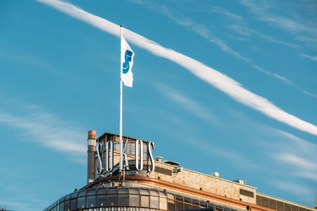 Helsinki, Finland. Flag With Logo Logotype On Roof Of Original Sokos Hotelのeditorial素材