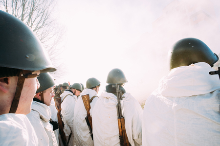 Re-enactors Dressed As Russian Soviet Infantry Soldiers Of World War II Standing In Row.のeditorial素材
